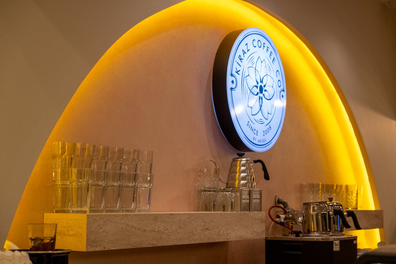 services-02 Stylish coffee shop interior featuring bar equipment and decorative lighting.